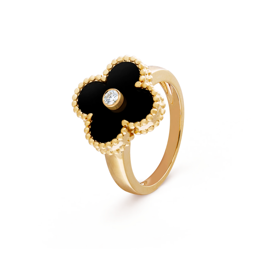 Gold ring with black flower design and diamond on a transparent background