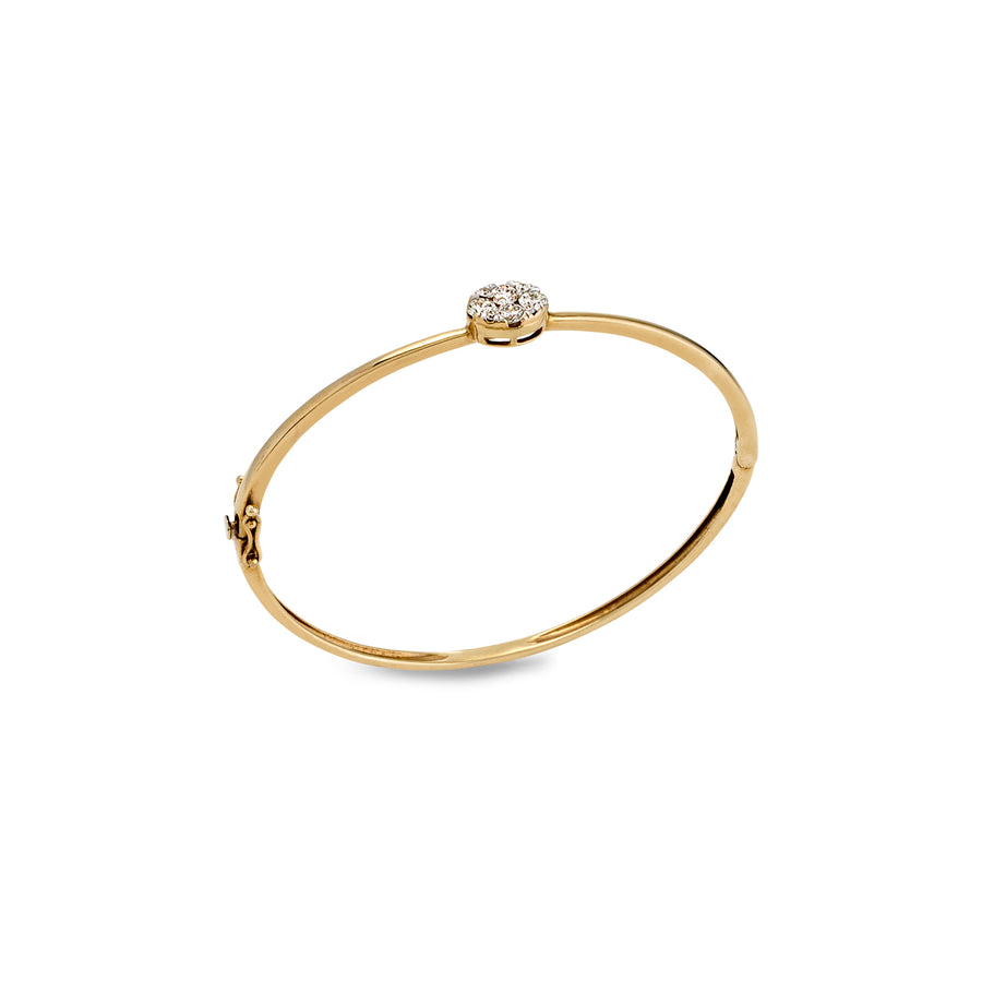 Angled side view of slim gold bangle with secure clasp and central moissanite detail