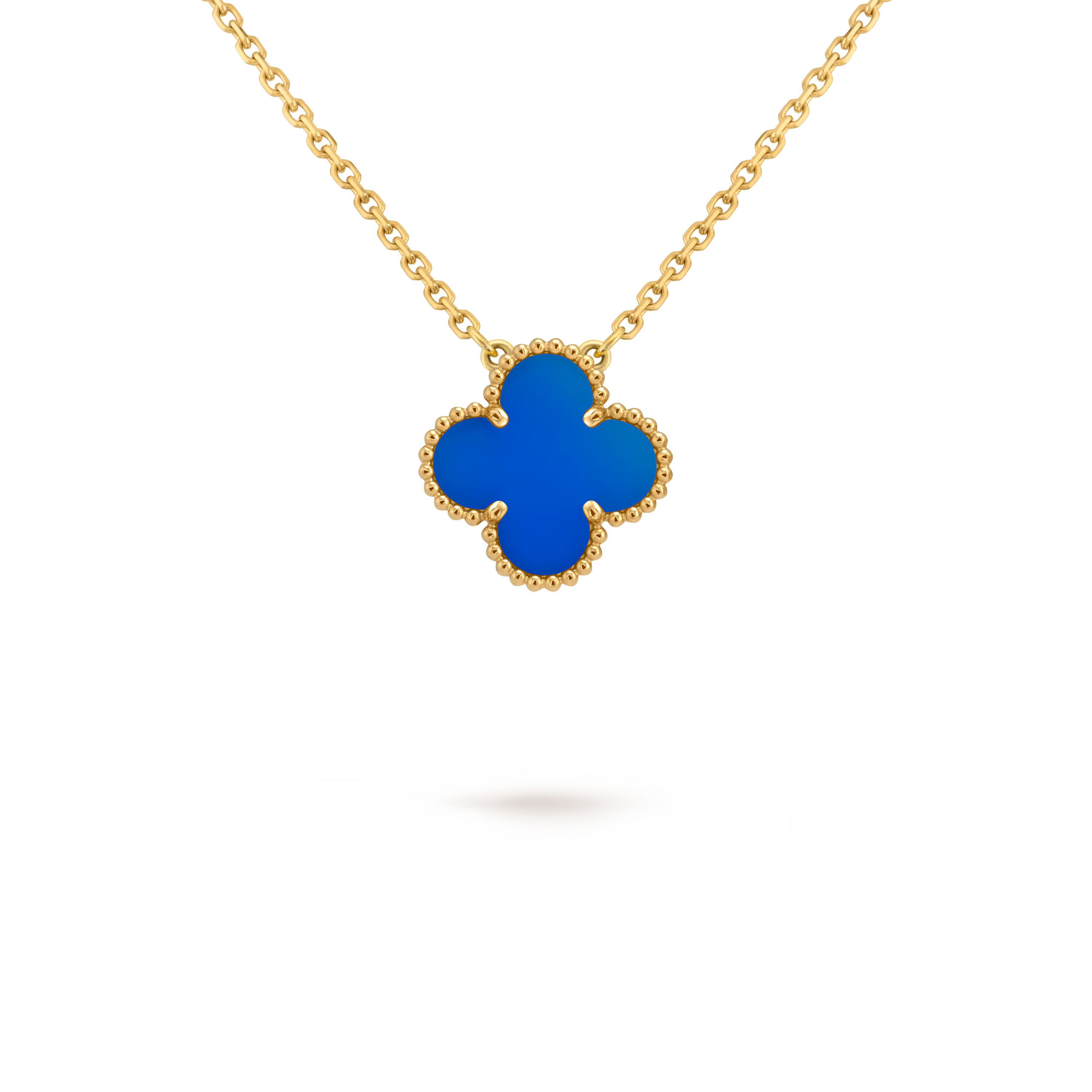 Gold necklace with a blue clover-shaped pendant on a black background