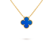 Gold necklace with a blue clover-shaped pendant on a black background
