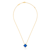 Gold necklace with a blue pendant on a white background