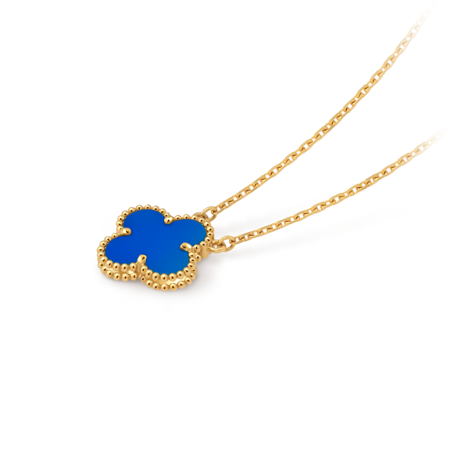 Gold necklace with a blue clover pendant on a black background