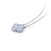 Silver hairpin with a cloud-shaped decorative element on a black background