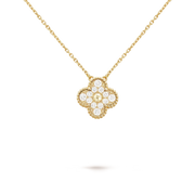 Gold necklace with a diamond pendant on a black background