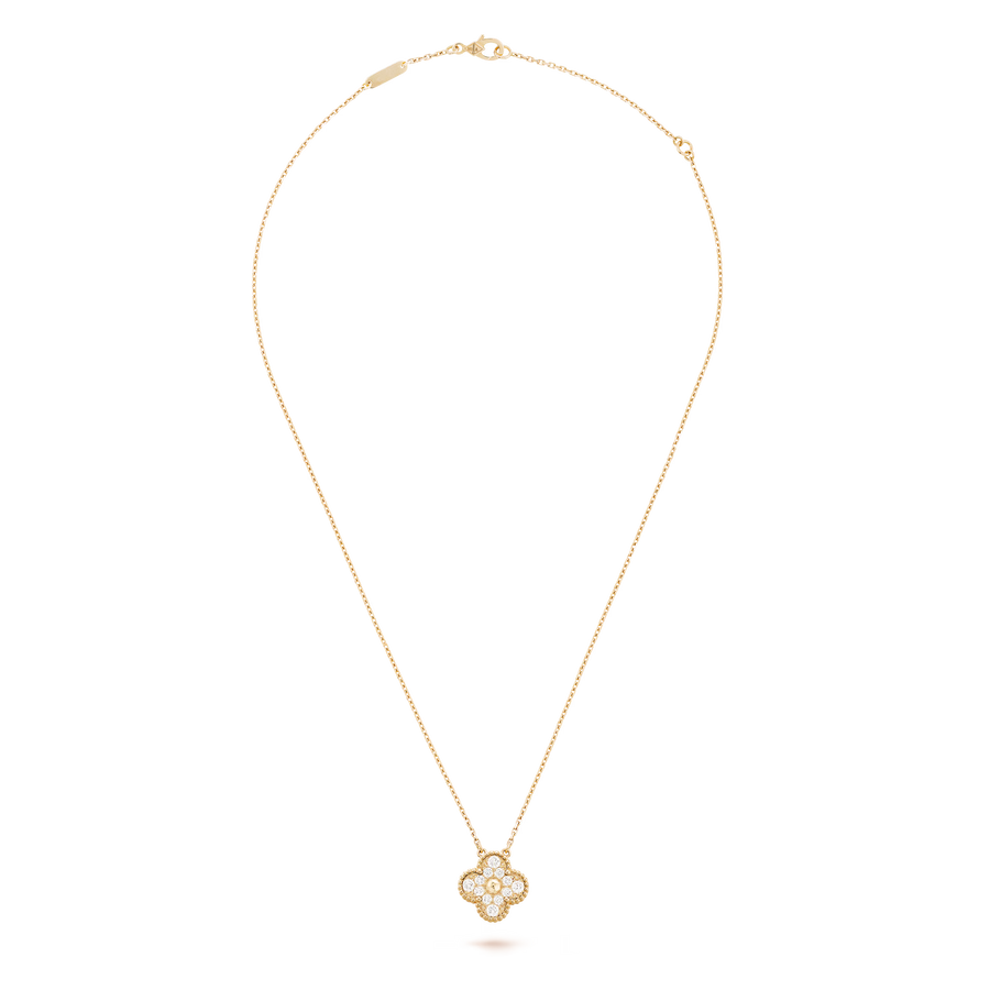 Gold necklace with a pendant on a black background