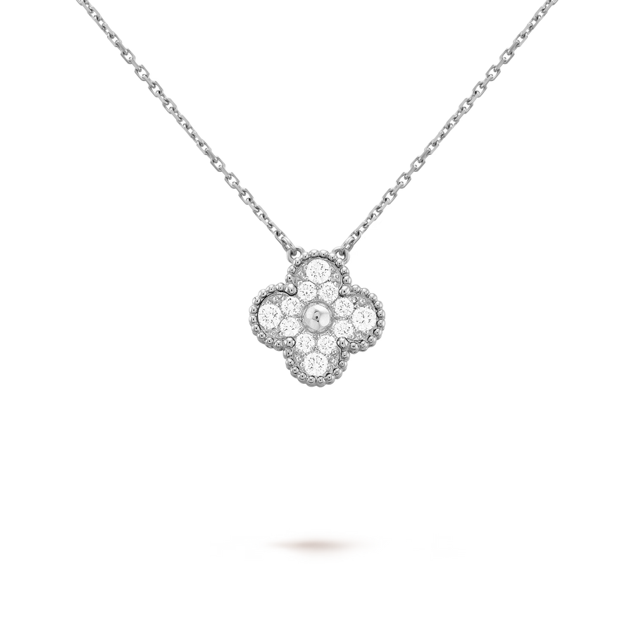 Diamond necklace with a clover-shaped pendant on a clear background