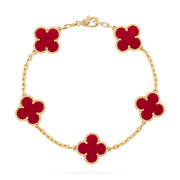 Five-motif clover bracelet with red carnelian-style inlay and gold beaded trim – flat lay