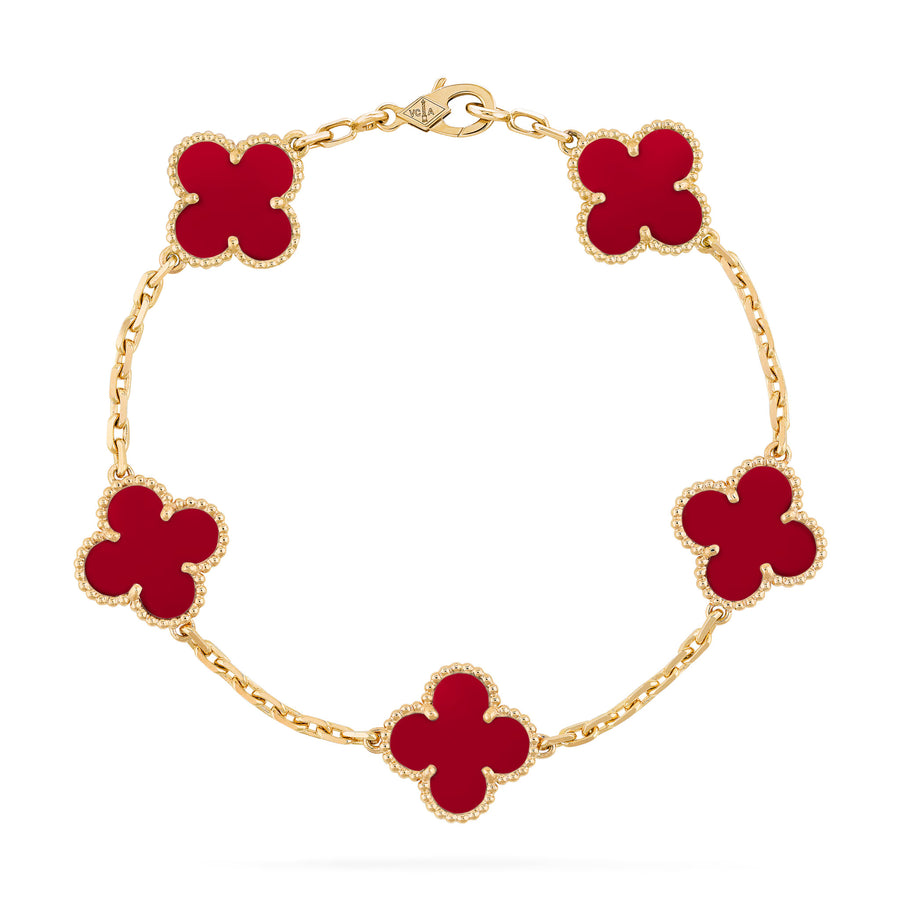 Five-motif clover bracelet with red carnelian-style inlay and gold beaded trim – flat lay
