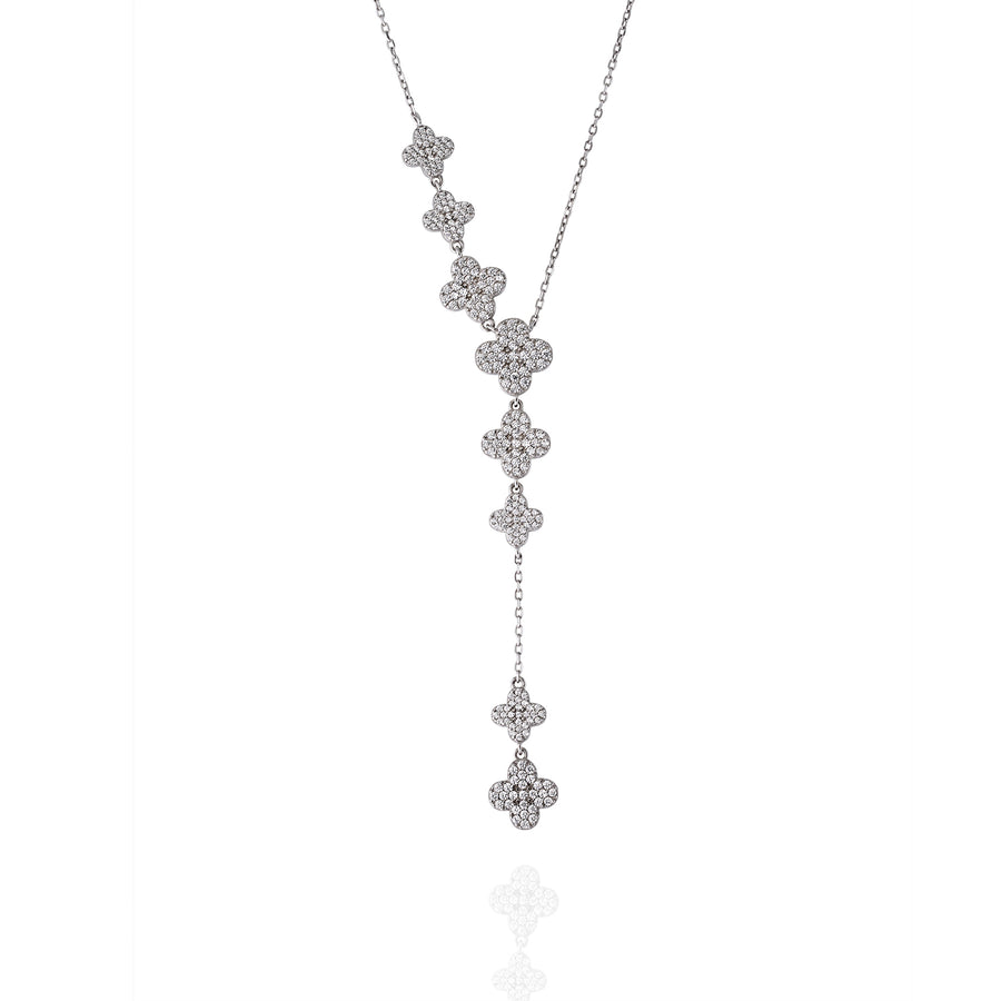 Close-up of silver Clover Drop necklace with cascading clover motifs set in pavé moissanite