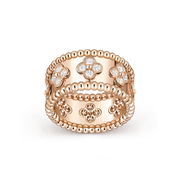 Rose gold ring with clover designs and diamonds on a transparent background