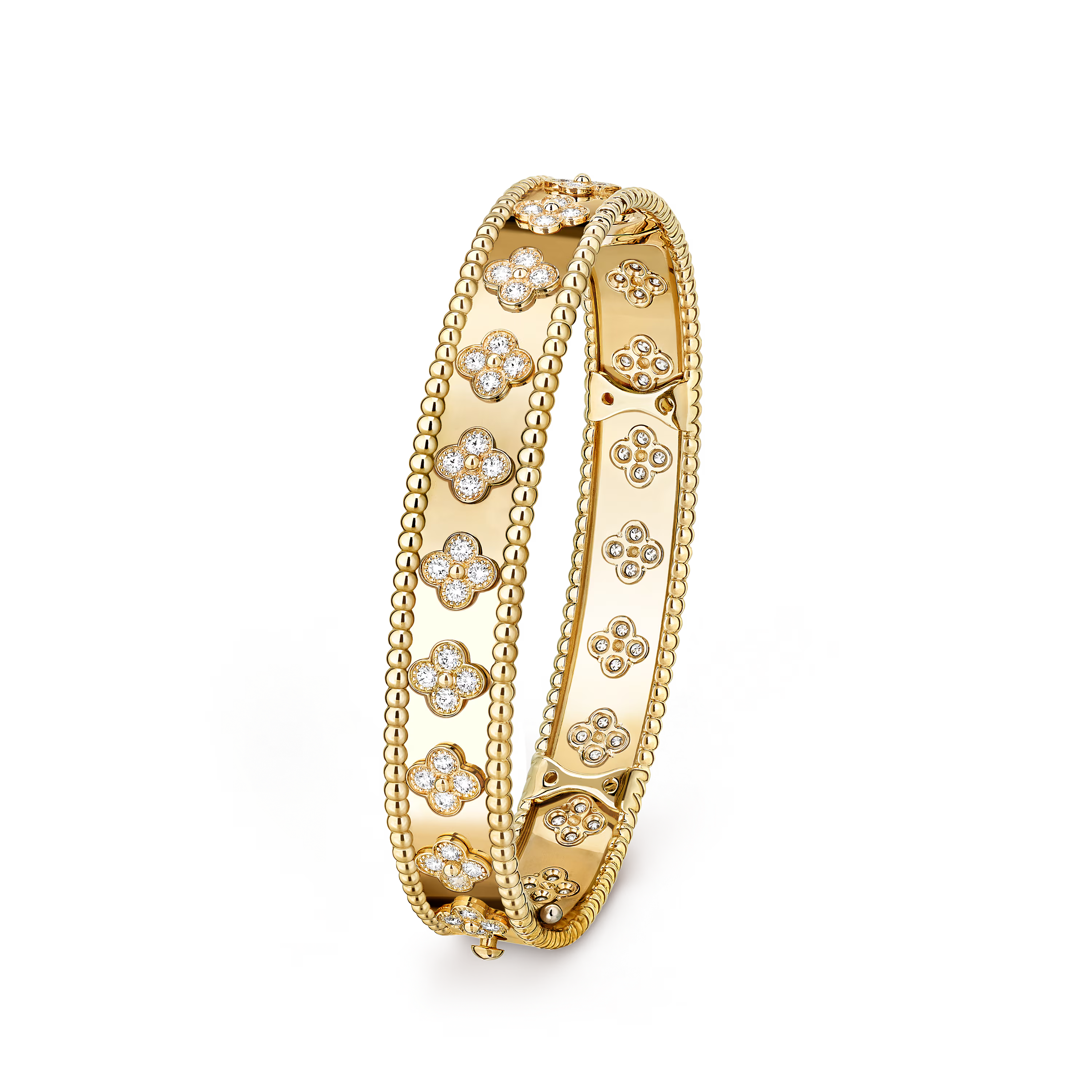Gold bracelet with floral designs on a black background
