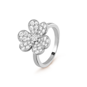 Silver flower-shaped ring with clear gemstones on a white background