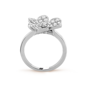 Silver ring with diamond flower design on a white background