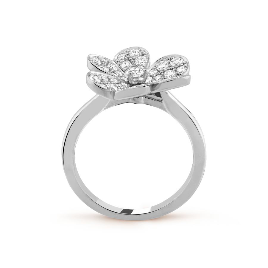 Silver ring with diamond flower design on a white background