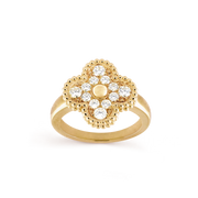 Gold ring with diamond accents on a black background