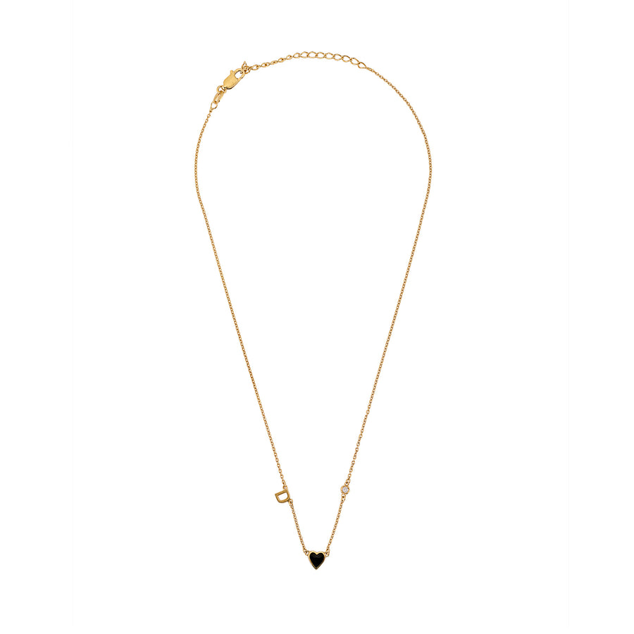 Full-length view of gold necklace with black heart charm, initial, and small decorative accents