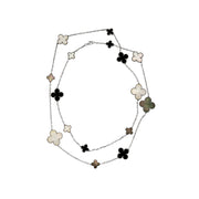 Long Clover necklace with alternating four-leaf motifs in black, white, and green inlay with delicate beaded borders