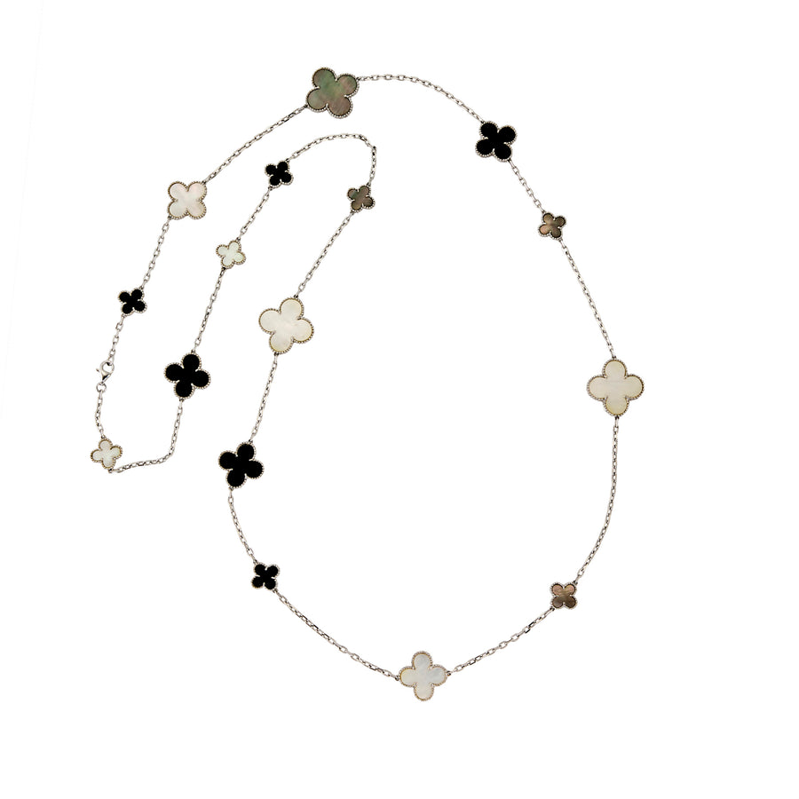 Full view of Long Clover station necklace showcasing multi-coloured inlay clovers on a fine chain