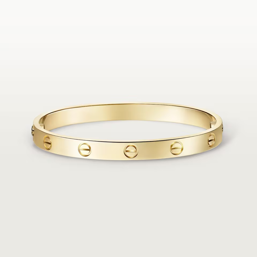 Gold bracelet with Love lock design on a light gray background