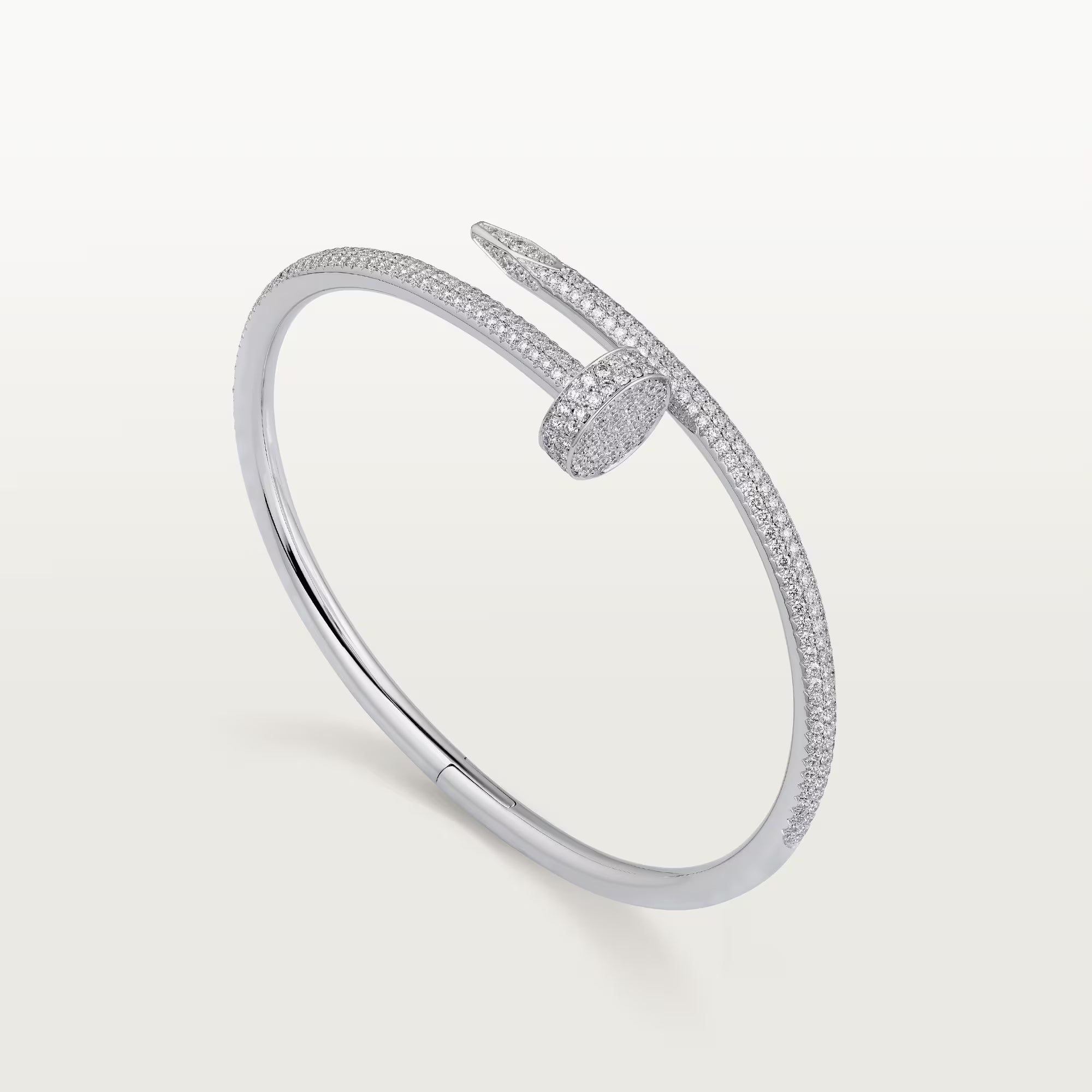 Silver bracelet with small stones on a light gray background
