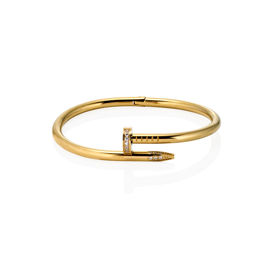 Side view of gold nail bracelet with pavé moissanite detailing at the head and tip