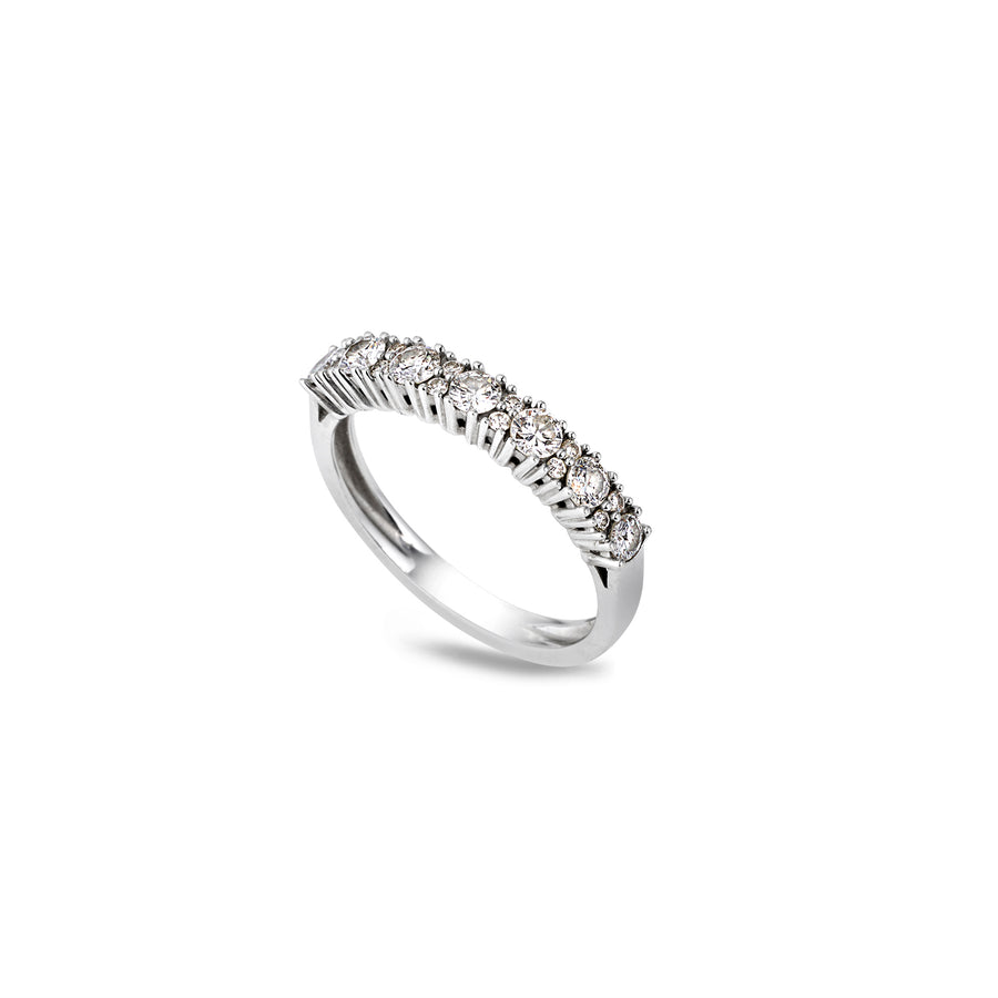 Angled view of Natasha ring with pavé-set moissanite stones in a half eternity design