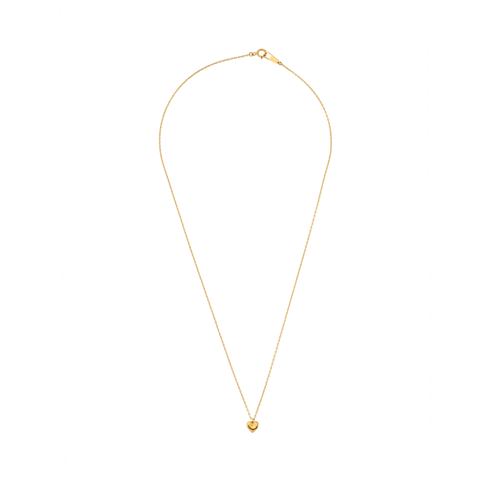 A delicate gold heart pendant necklace laid flat on a white background, featuring a fine chain and petite polished heart charm.