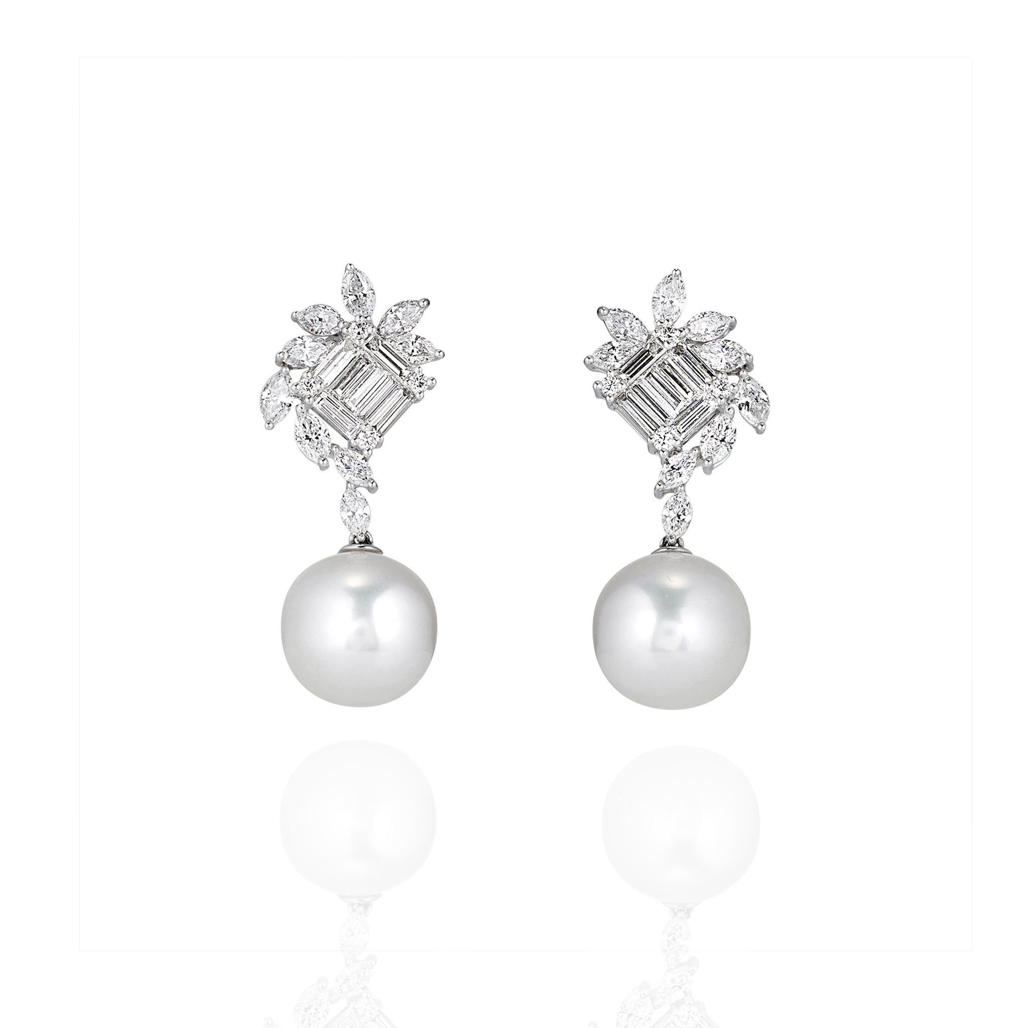 Front view of pearl drop earrings with moissanite cluster tops and round pearl drops