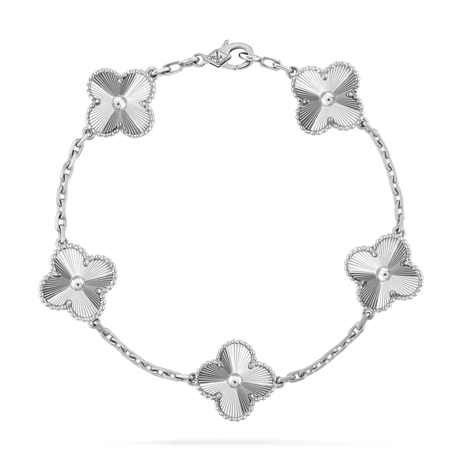 Silver bracelet with floral designs on a white background