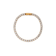 Top-down view of tennis bracelet with gold setting and continuous round moissanite stones