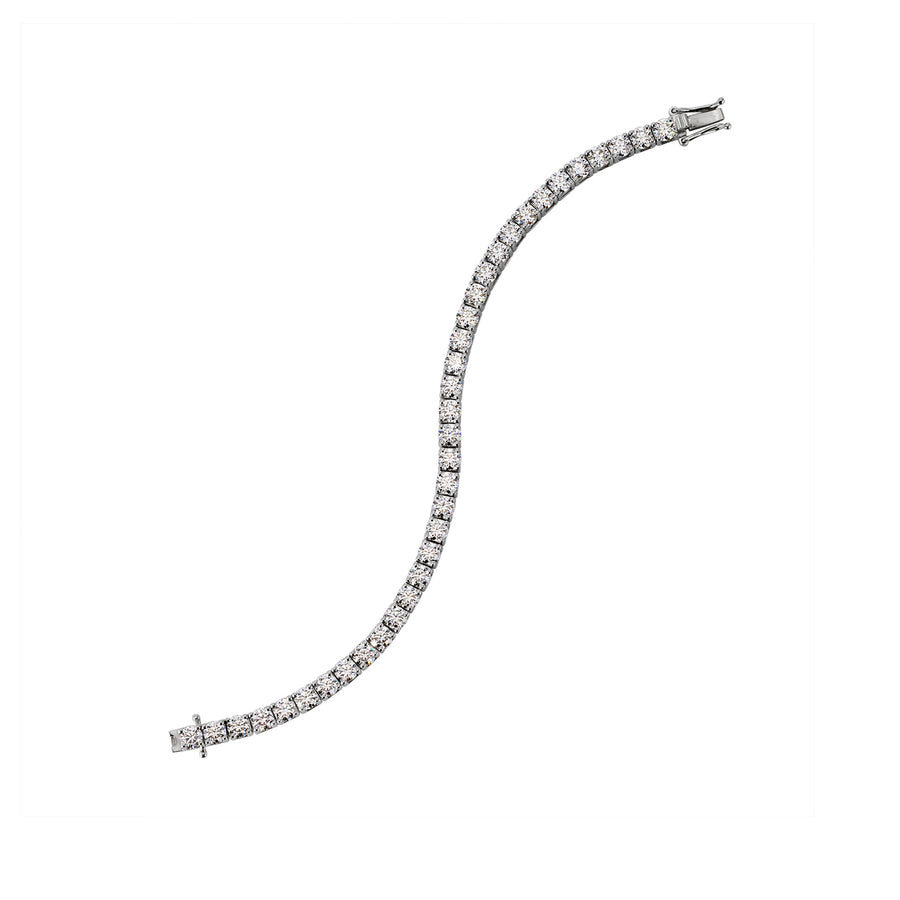 Curved overhead view of moissanite tennis bracelet showing fluid design and stone brilliance