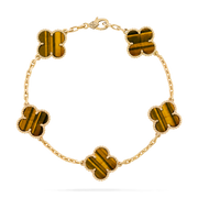 Gold bracelet with tiger eye stones on a clear background