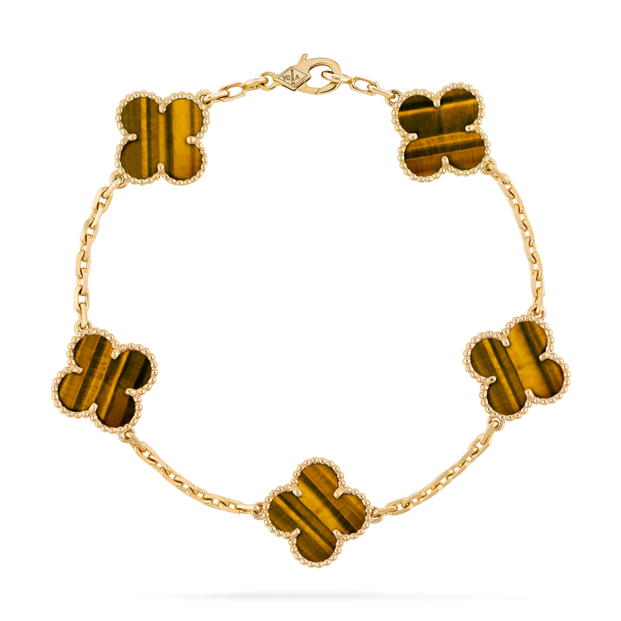 Gold bracelet with tiger eye stones on a clear background