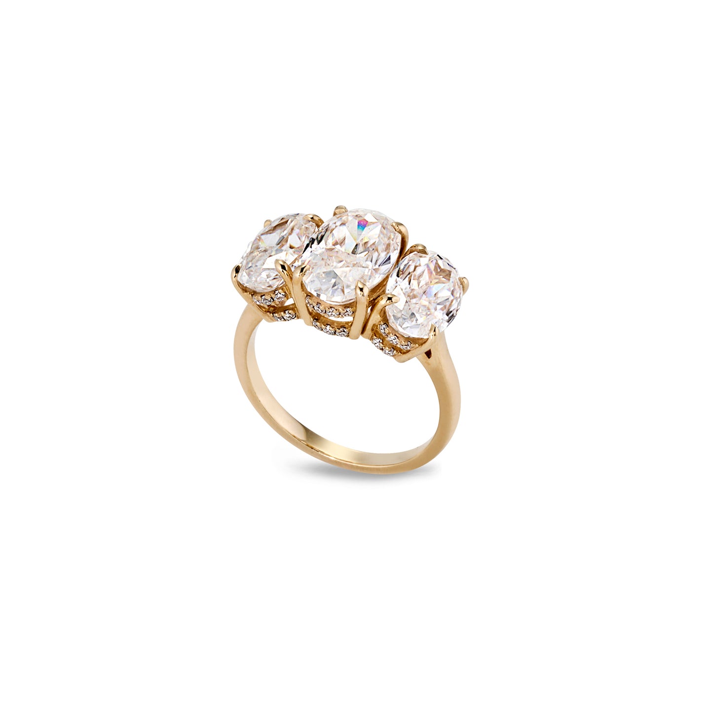 Three-stone oval moissanite ring with pavé detailing, angled side view showing setting and band