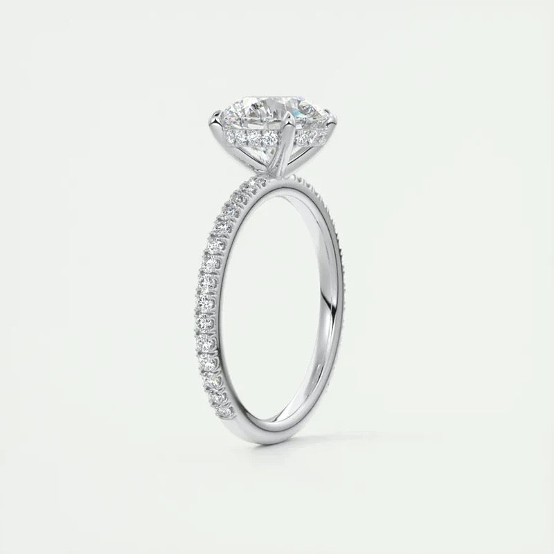 Moissanite engagement ring with hidden halo and pave band in silver