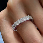 Close-up of Baguette Hidden Pink ring on hand – white baguette stones detail