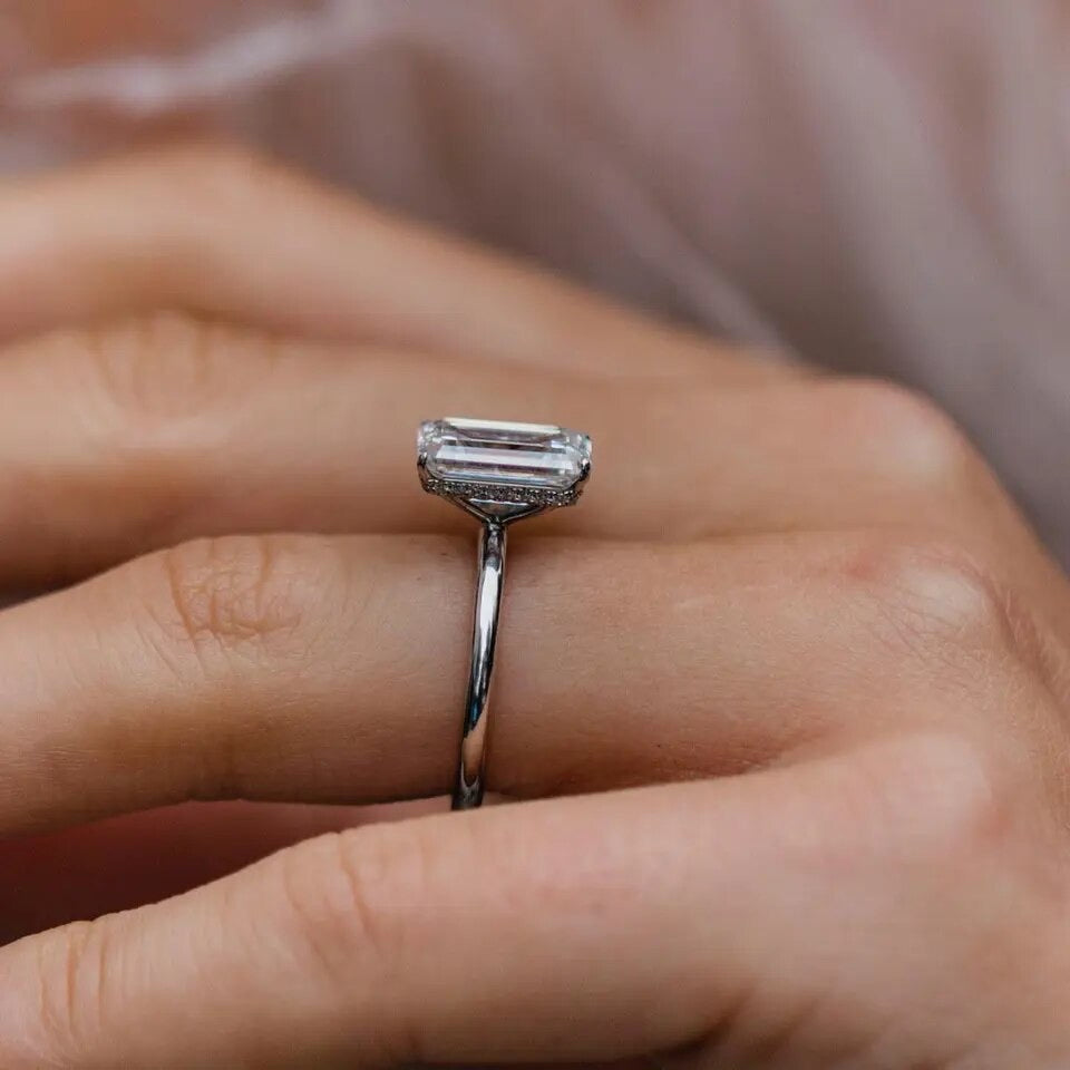 Close-up side view of Diana moissanite ring in silver