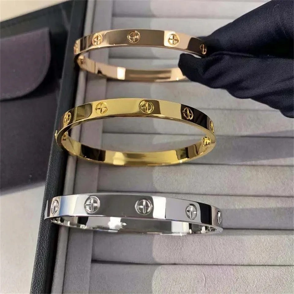 Gold, silver, and rose gold Forever Bracelets stacked together