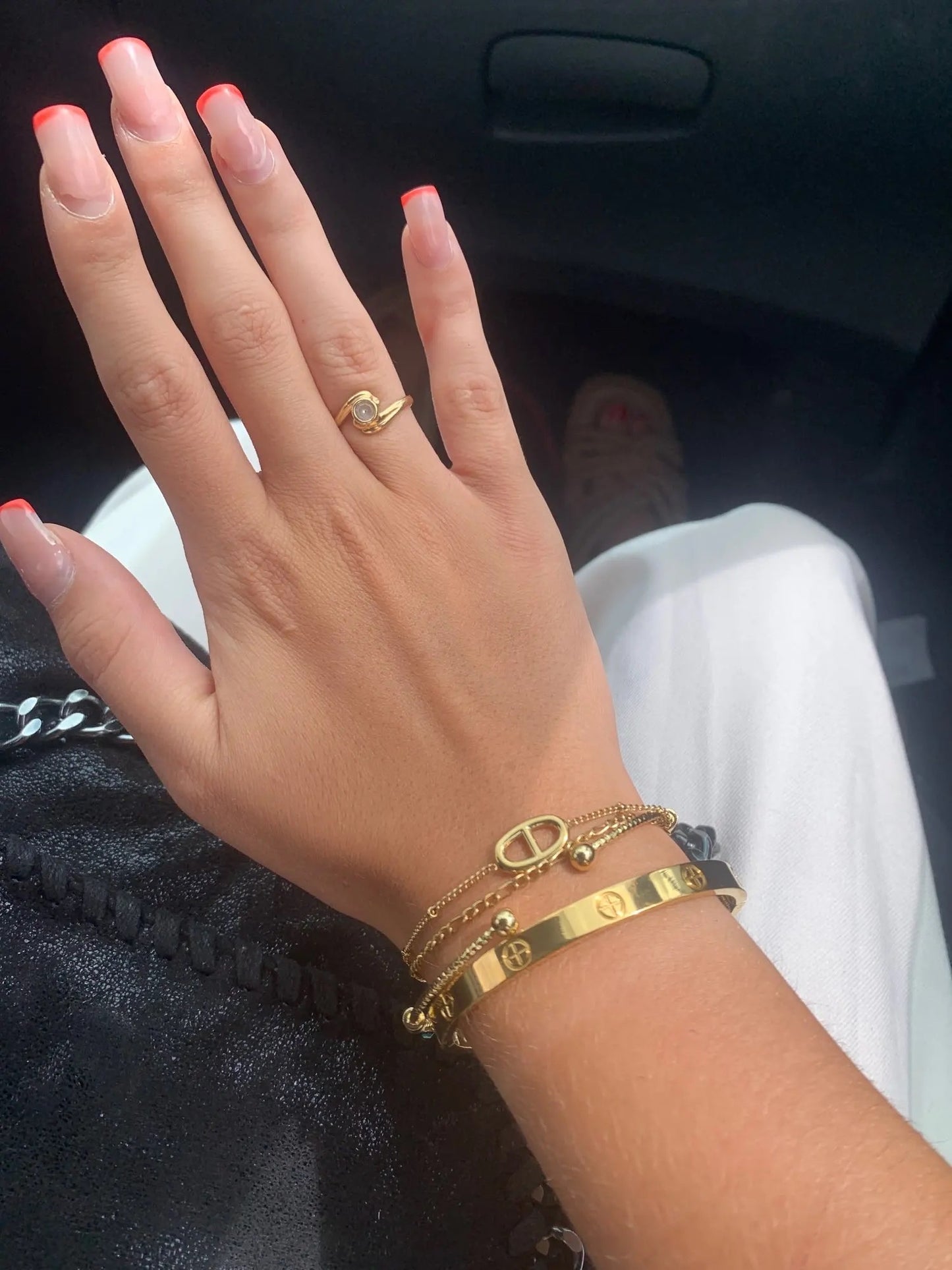 Gold Forever Bracelet worn on wrist with neutral outfit