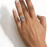 Hand wearing Sage ring against neutral background