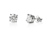Pair of diamond stud earrings on a white background