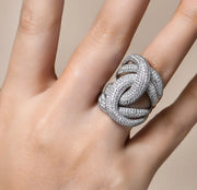 Close-up of Twist Moissanite ring worn on hand – detailed pavé design