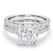Close-up of Armani Moissanite engagement and wedding ring set in white gold