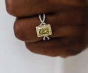 Eden ring on model's finger, radiant yellow stone