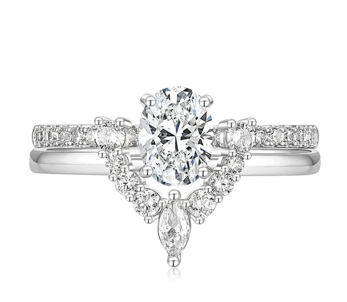Eleanor bridal set featuring 1.5ct oval Moissanite and pavé band