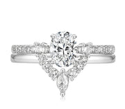 Eleanor bridal set featuring 1.5ct oval Moissanite and pavé band