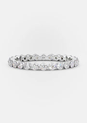 A two-row Moissanite stacking band ring with white gold plating.