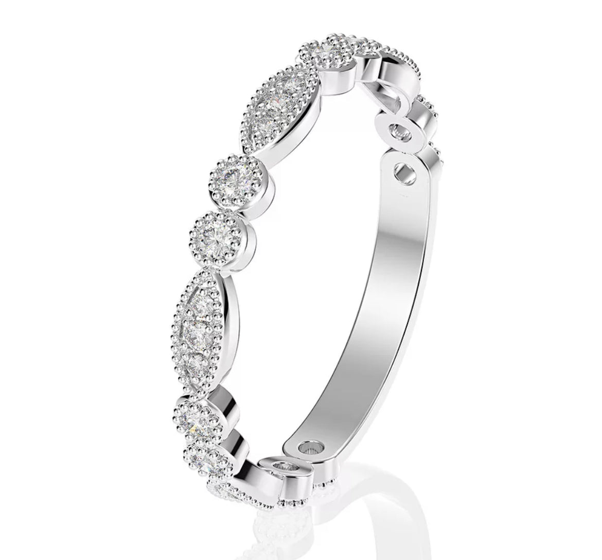 A Moissanite bridal ring set with a central radiant cut stone, surrounded by smaller stones set in a band, crafted in silver or gold.