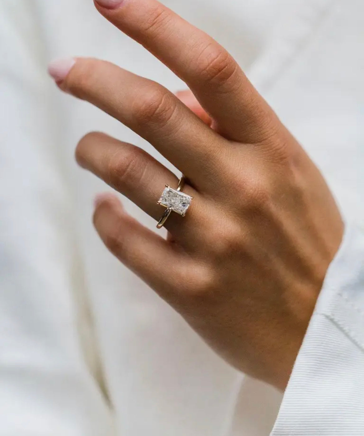 Model wearing the Madeline ring with radiant Moissanite centre stone
