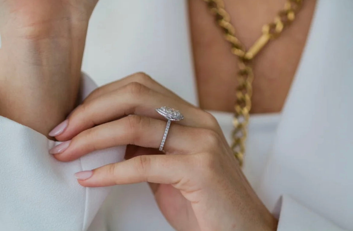 Bride styling the Portia pear Moissanite ring, showcasing elegant double halo design